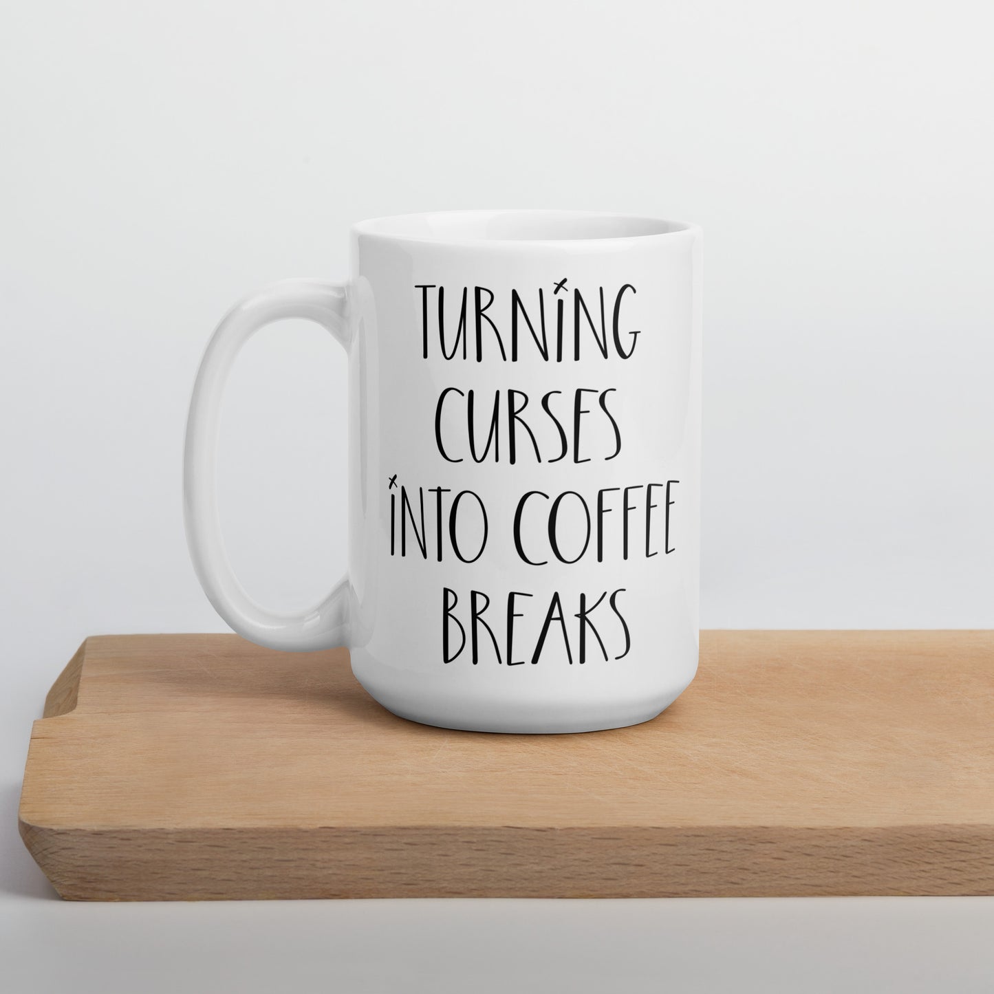 Voodoo Doll Coffee Mug: "Turning curses into coffee breaks"